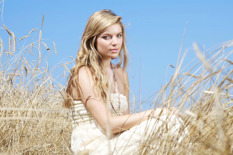 Woman in a field of tall grass