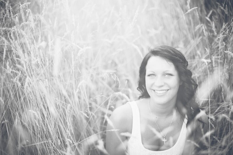 woman in a field of tall grass