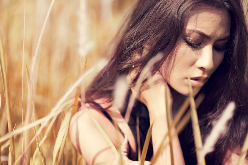 woman in a field of tall grass