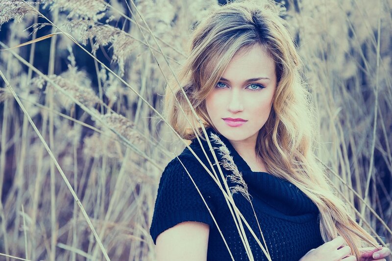 woman in a field of tall grass