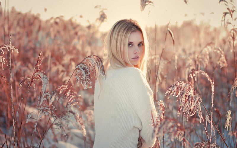 woman in a field of tall grass