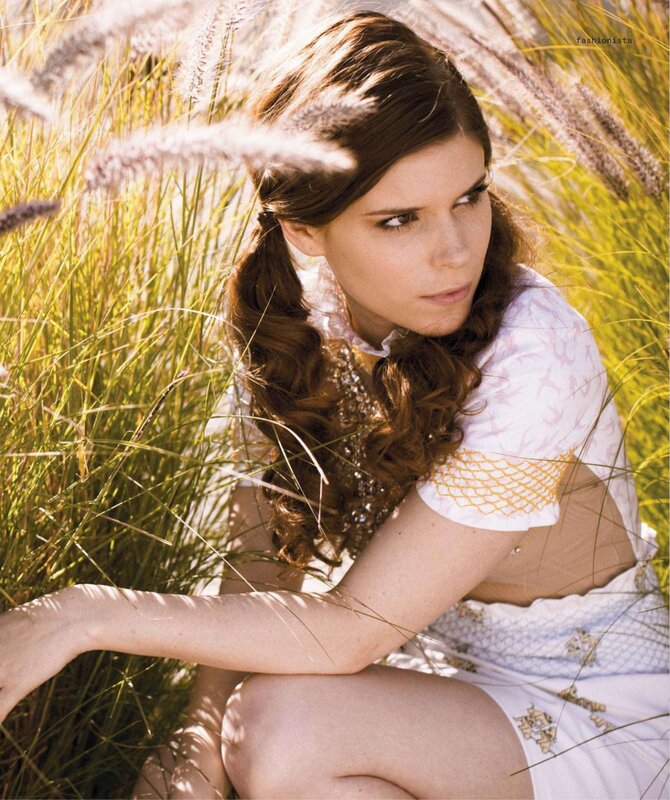 woman in a field of tall grass