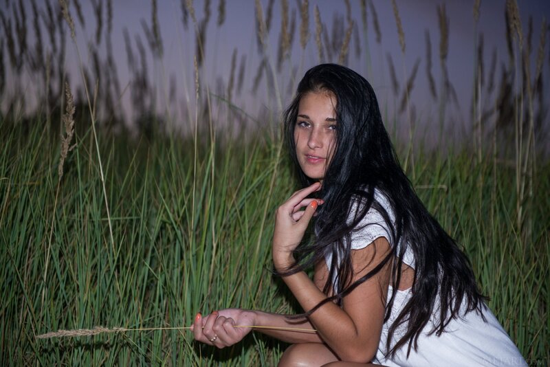 woman in a field of tall grass