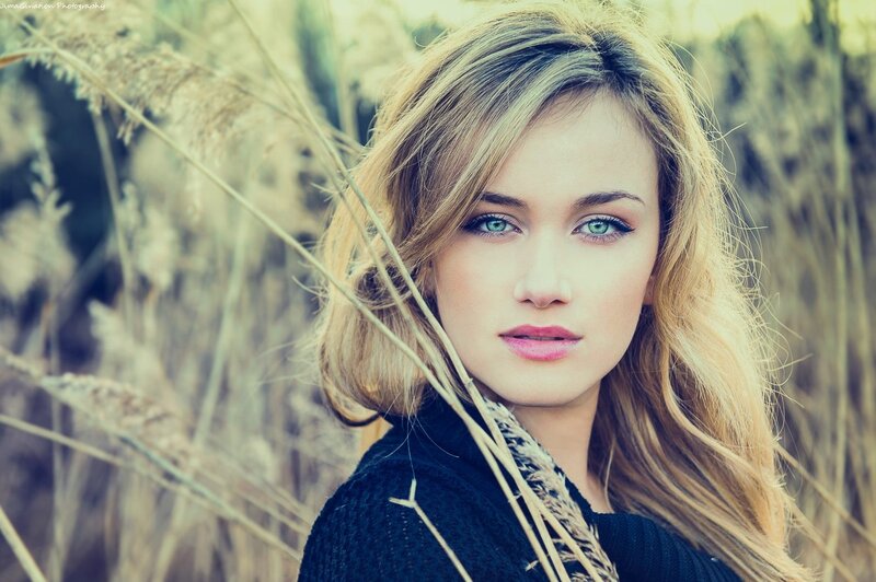 woman in a field of tall grass