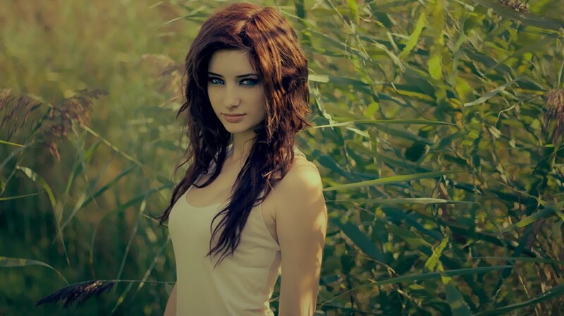 woman in a field of tall grass