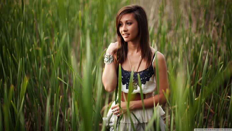 woman in a field of tall grass