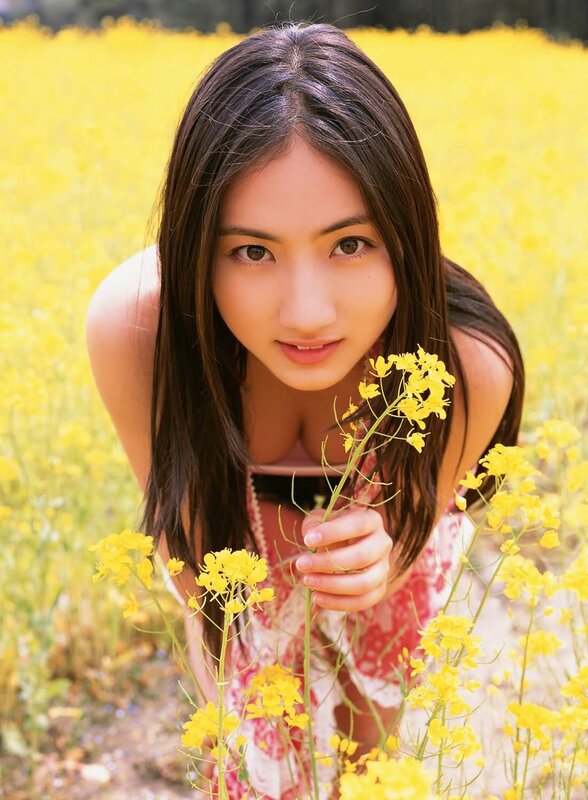 Woman in a field of yellow flowers