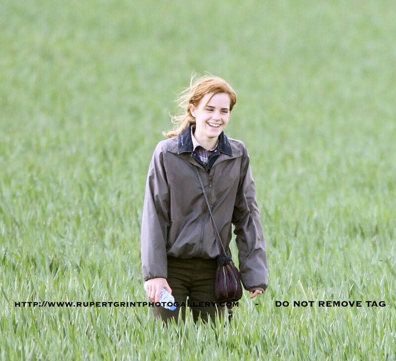 woman in a field smiling