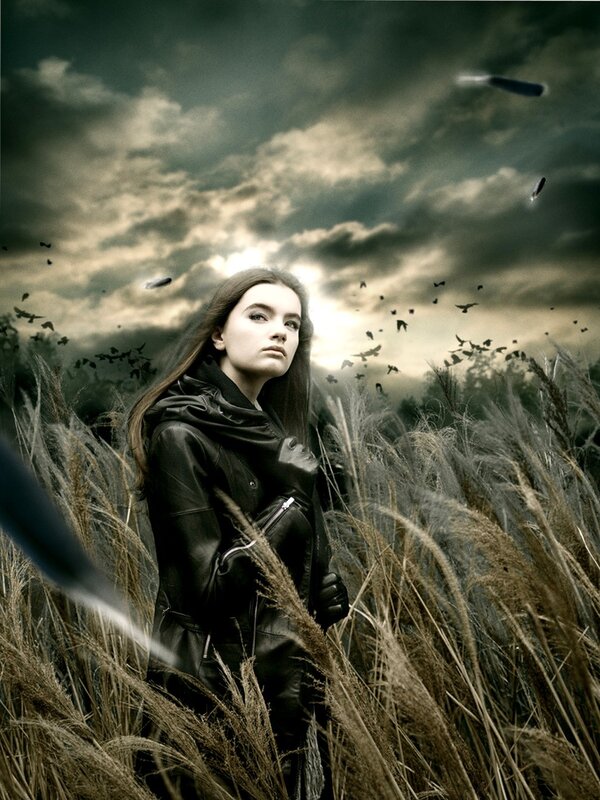 woman in a field with birds