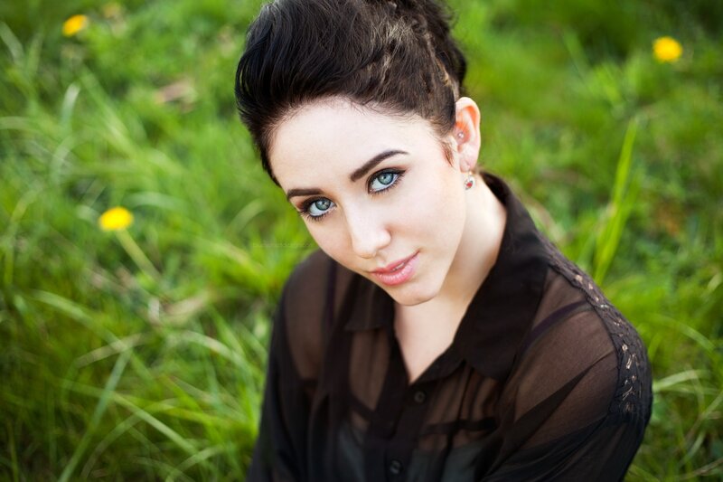 woman in a field with blue eyes
