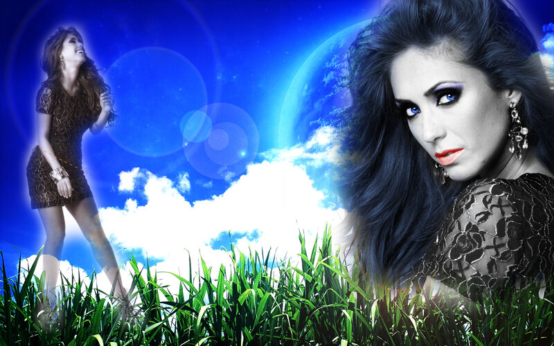 woman in a field with blue sky