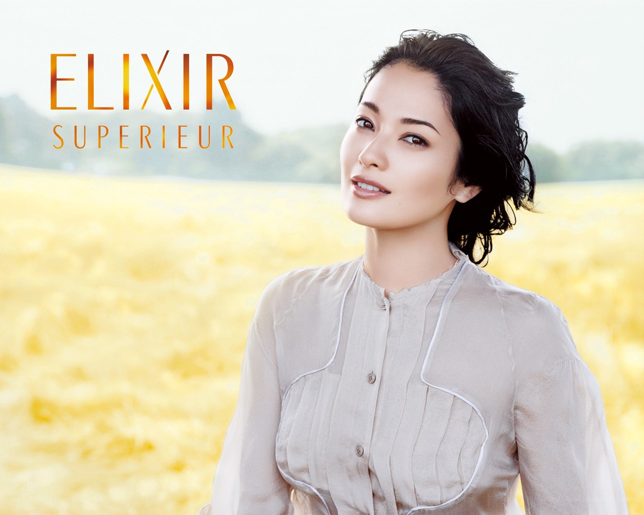 Woman in a field with Elixir Superior