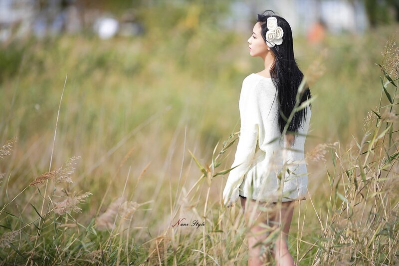 Woman in a field with flowers