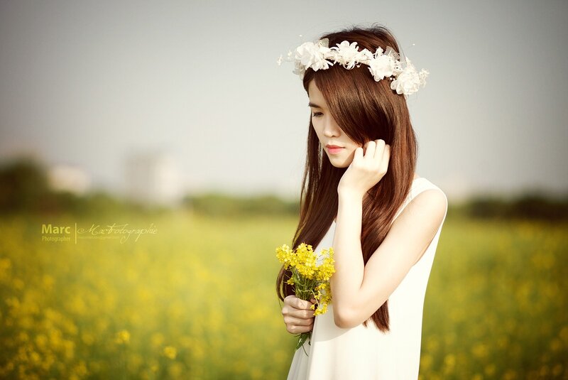 woman in a field with flowers