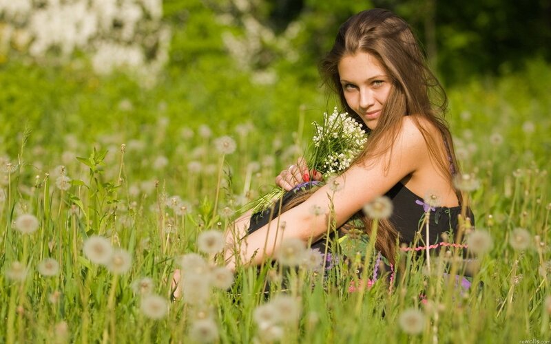 woman in a field with flowers