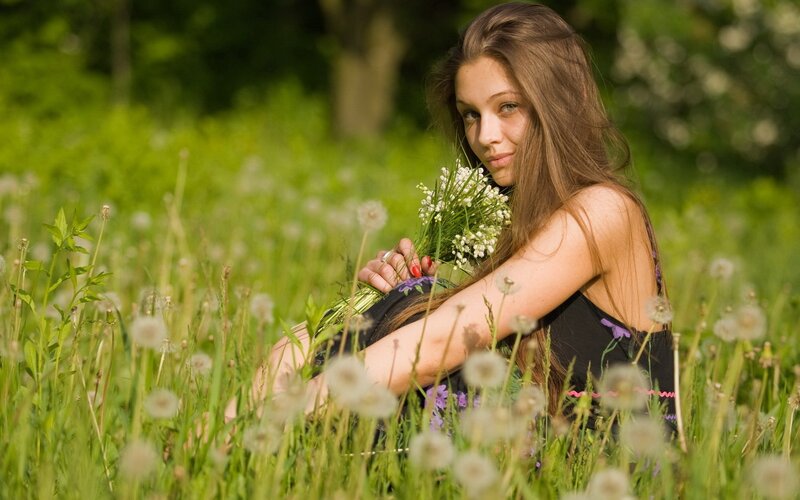 woman in a field with flowers