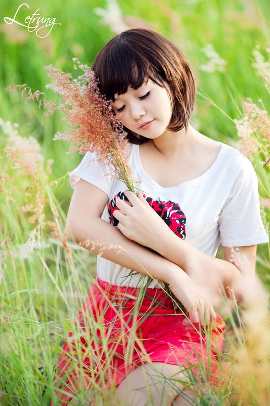 woman in a field with flowers