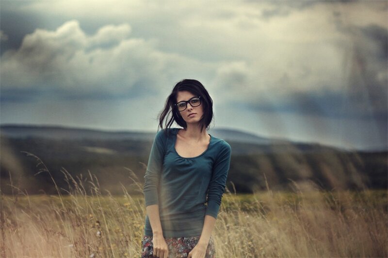 woman in a field with glasses