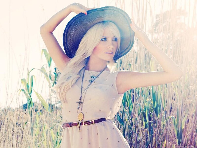 Woman in a field with hat