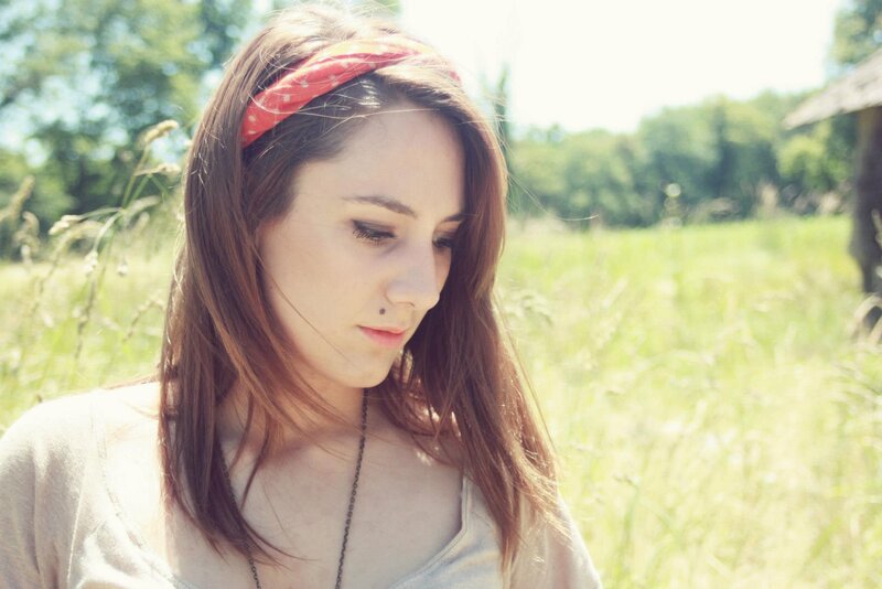 woman in a field with headband