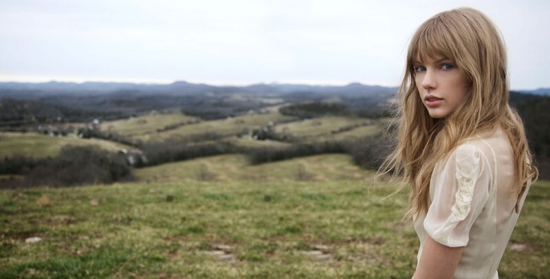 woman in a field with hills