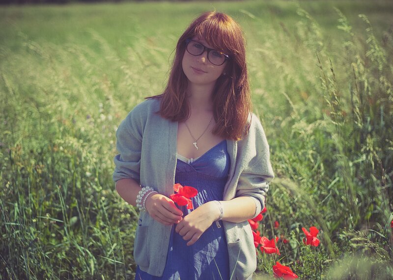 Woman in a field with poppies