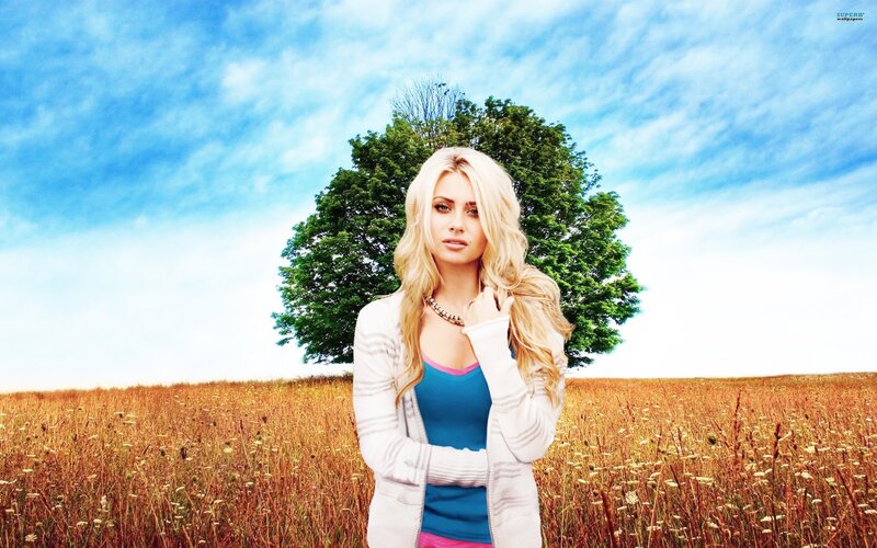 woman in a field with tree