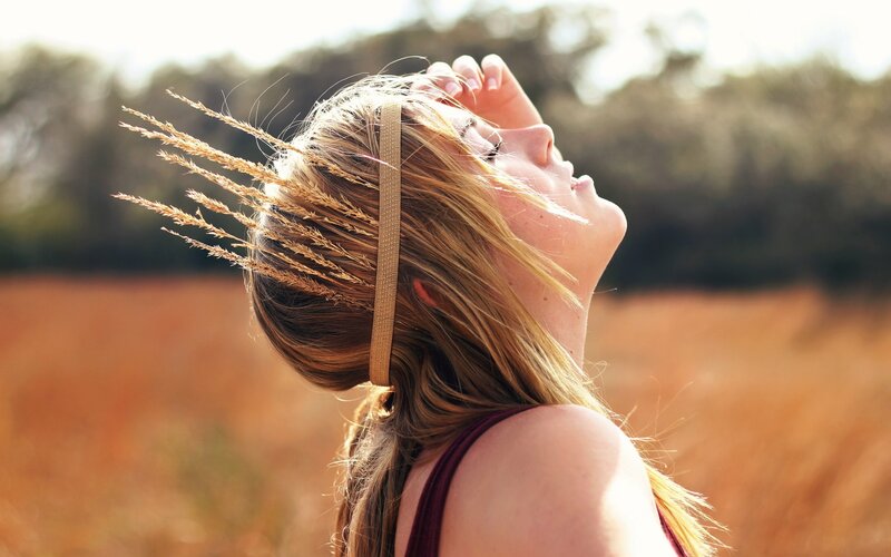 Woman in a field with wheat