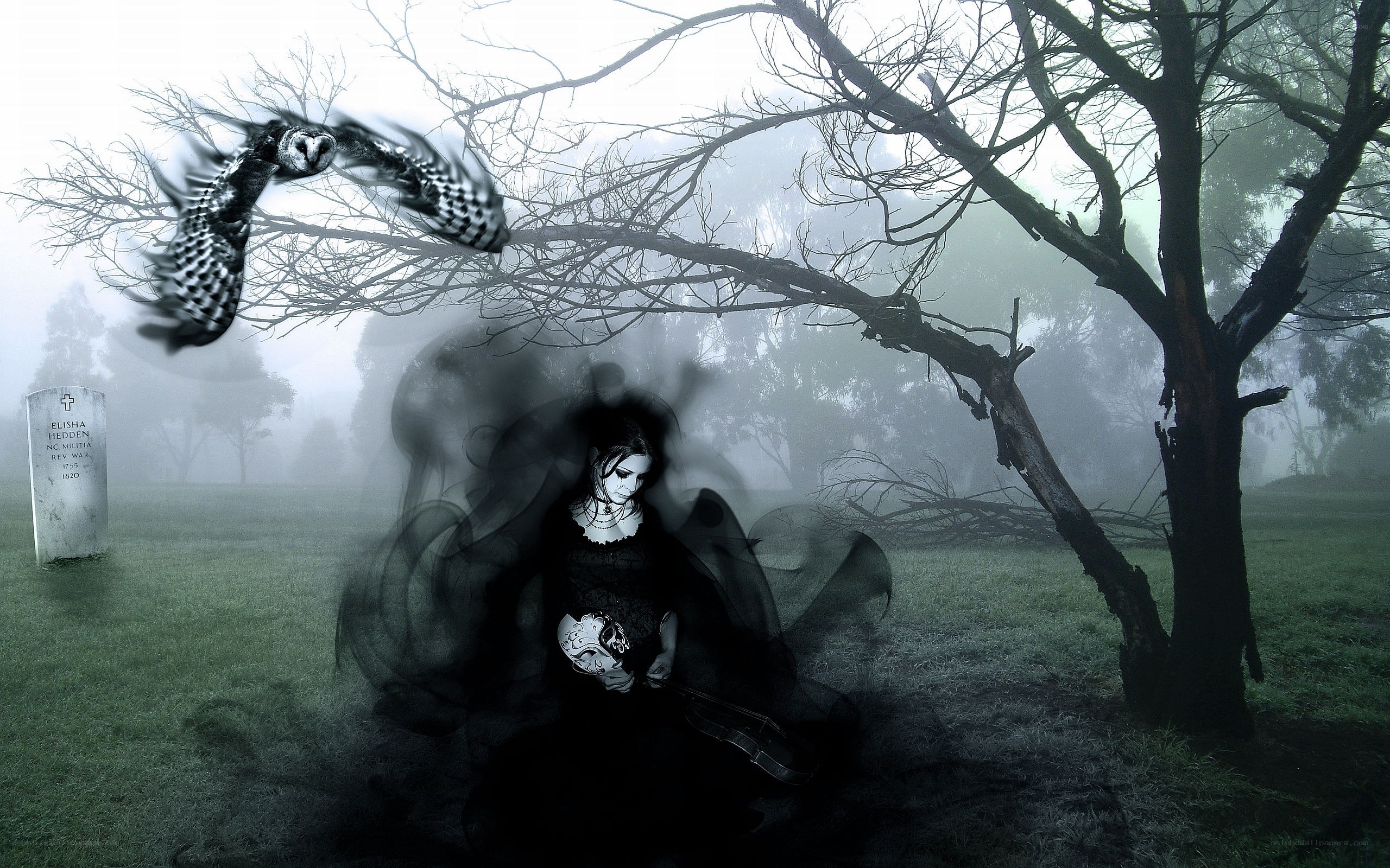 Woman in a foggy graveyard