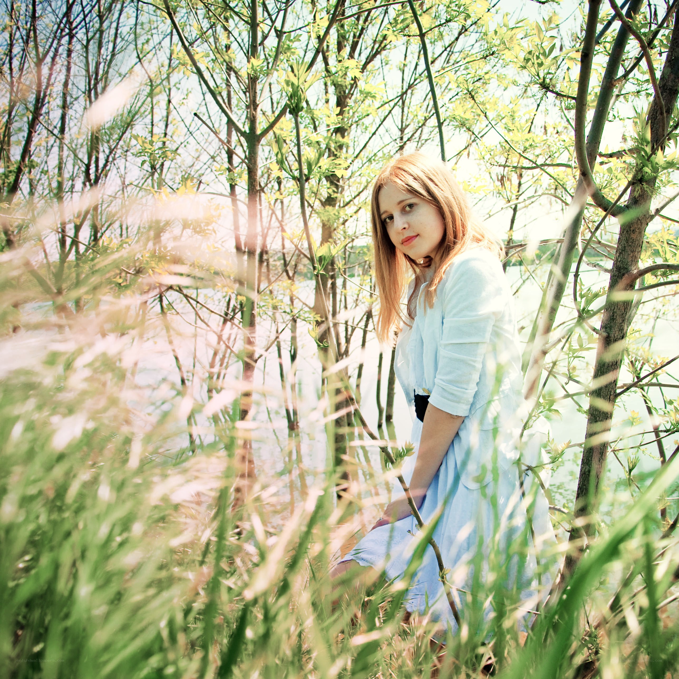 Woman in a forest clearing