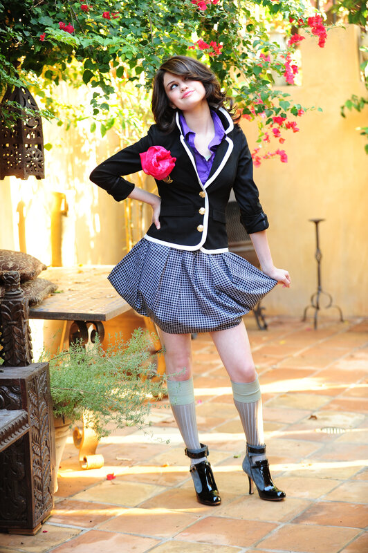 woman in a garden wearing a blazer