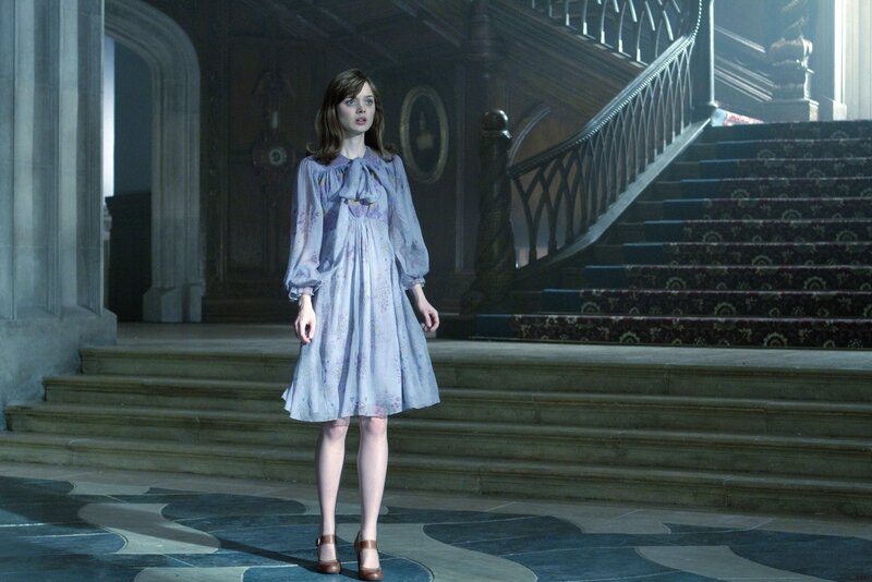 Woman in a grand hall