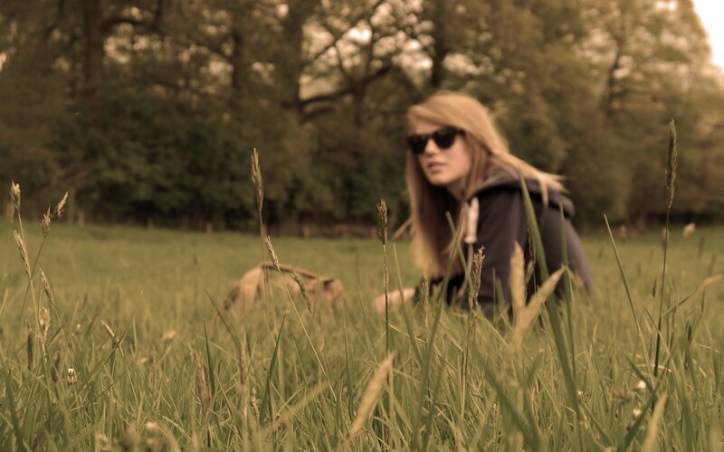woman in a grassy field