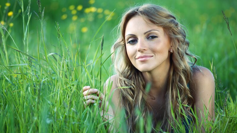 woman in a grassy field