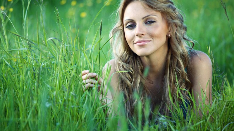 woman in a grassy field