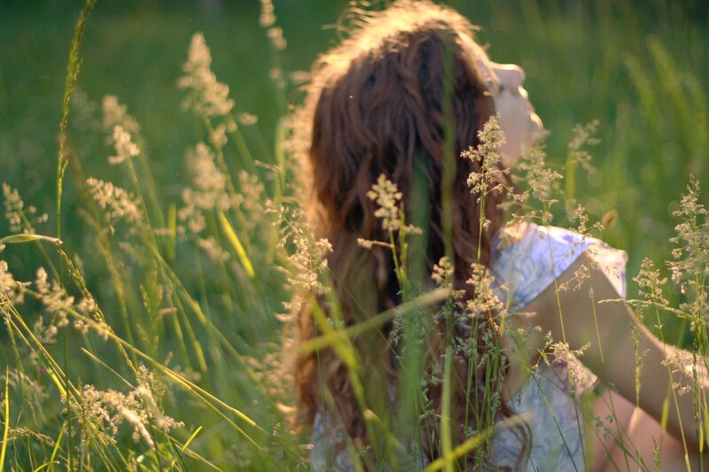 woman in a grassy field
