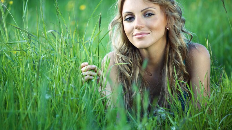 woman in a grassy field