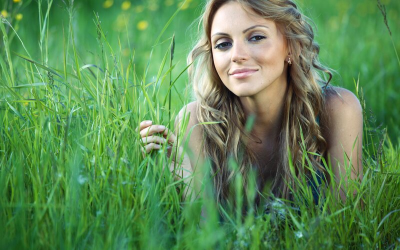 woman in a grassy field