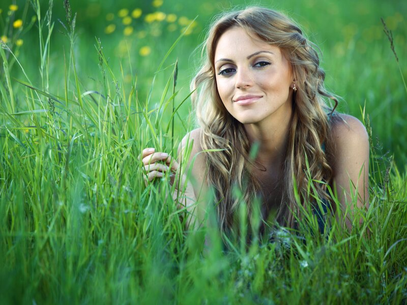 woman in a grassy field