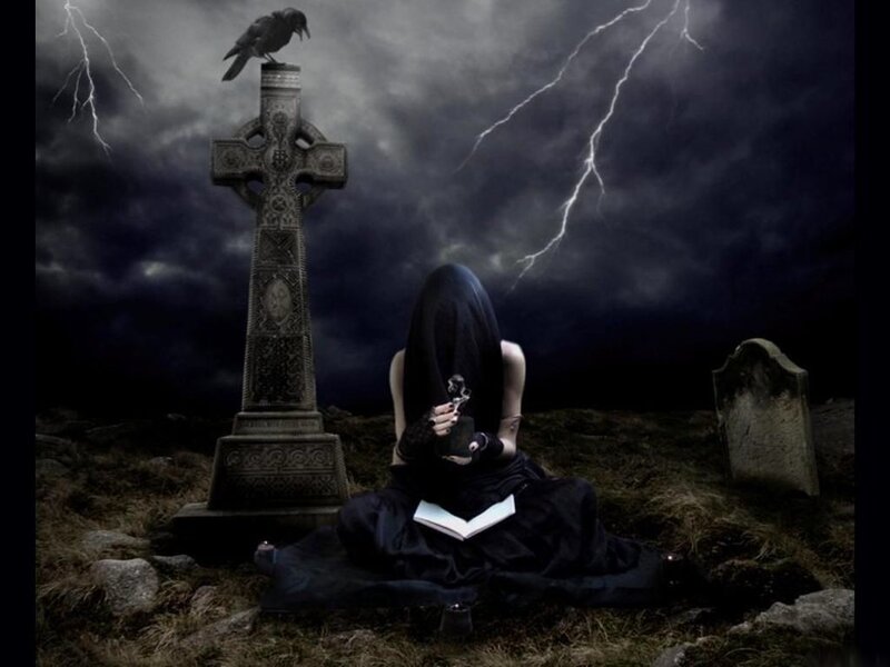 Woman in a graveyard at night