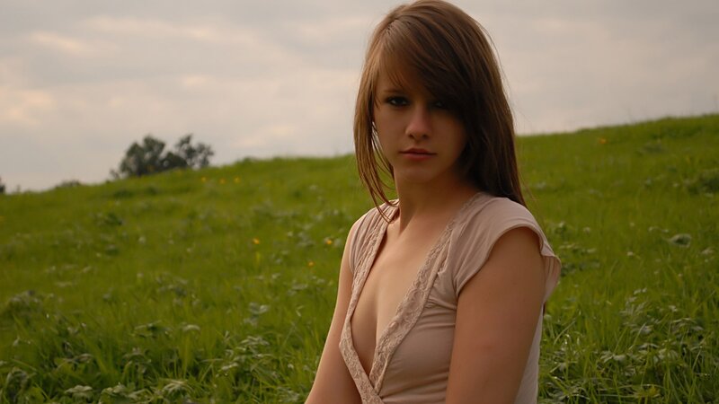 woman in a green field