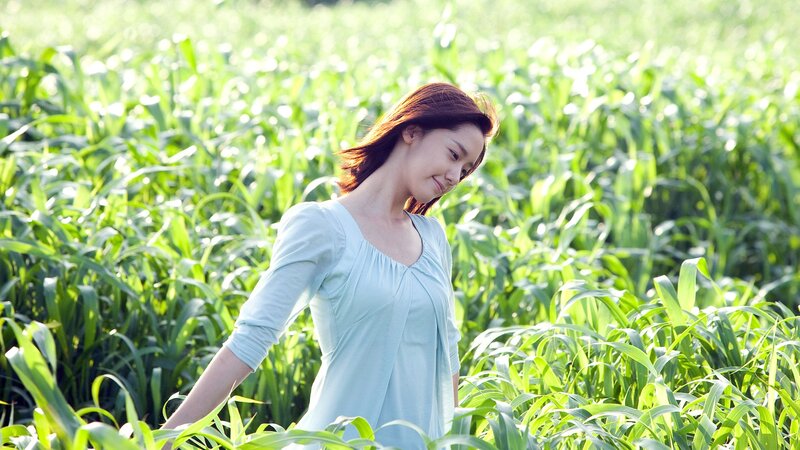 woman in a green field