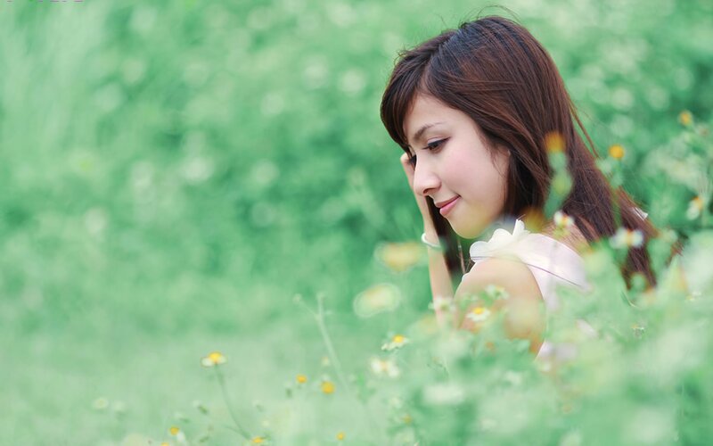 woman in a green field