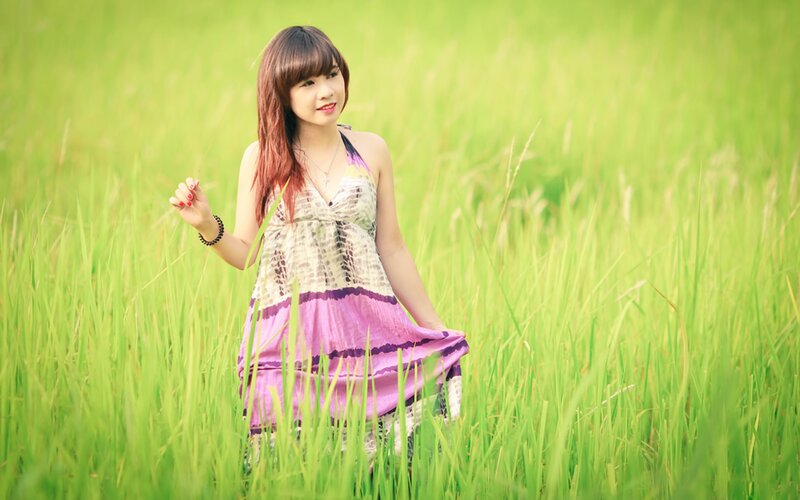 woman in a green field