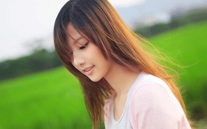 woman in a green field