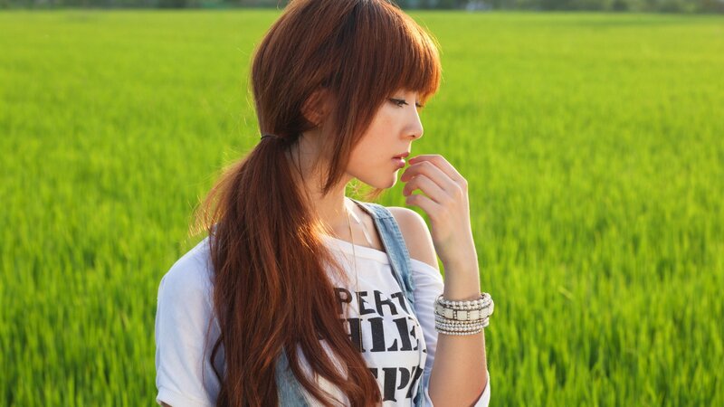 woman in a green field