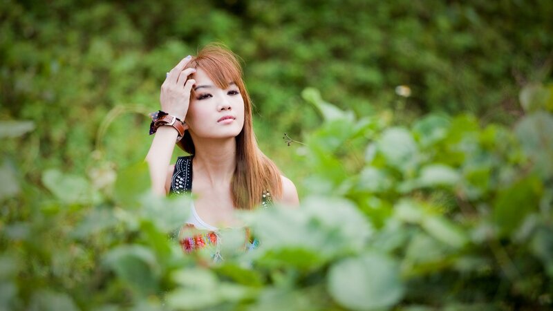 woman in a green field