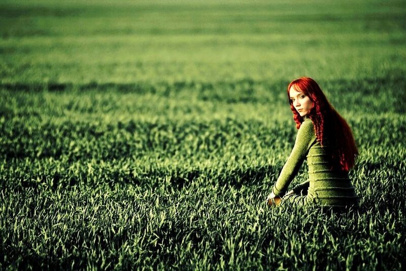 woman in a green field