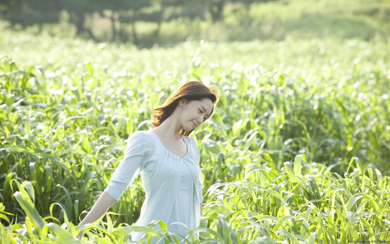 woman in a green field