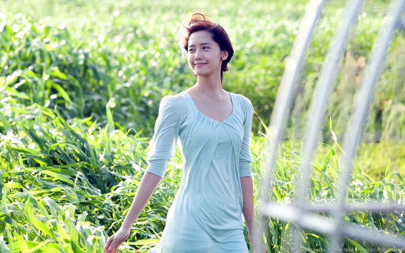 woman in a green field